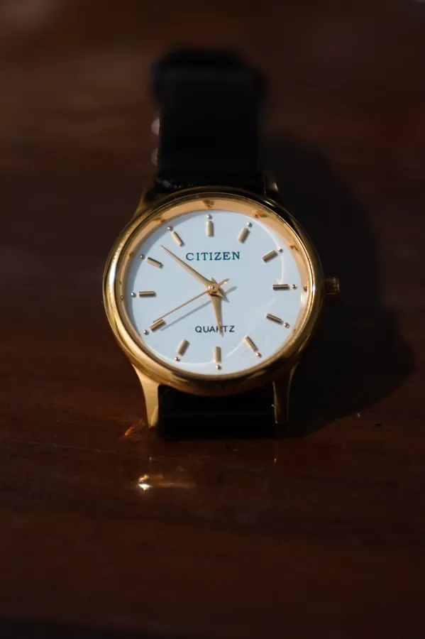 Wristwatch on a wooden surface, before background removal